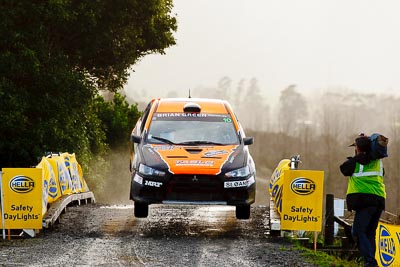 10;10;16-July-2011;APRC;Asia-Pacific-Rally-Championship;International-Rally-Of-Whangarei;Mitsubishi-Lancer-Evolution-X;NZ;New-Zealand;Northland;Rally;Sloan-Cox;Tarryn-Cox;Whangarei;auto;garage;motorsport;racing;special-stage;super-telephoto