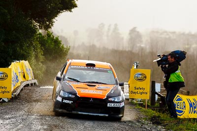 10;10;16-July-2011;APRC;Asia-Pacific-Rally-Championship;International-Rally-Of-Whangarei;Mitsubishi-Lancer-Evolution-X;NZ;New-Zealand;Northland;Rally;Sloan-Cox;Tarryn-Cox;Whangarei;auto;garage;motorsport;racing;special-stage;super-telephoto