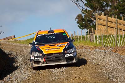 10;10;16-July-2011;APRC;Asia-Pacific-Rally-Championship;International-Rally-Of-Whangarei;Mitsubishi-Lancer-Evolution-X;NZ;New-Zealand;Northland;Rally;Sloan-Cox;Tarryn-Cox;Whangarei;auto;garage;motorsport;racing;special-stage;telephoto