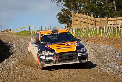 10;10;16-July-2011;APRC;Asia-Pacific-Rally-Championship;International-Rally-Of-Whangarei;Mitsubishi-Lancer-Evolution-X;NZ;New-Zealand;Northland;Rally;Sloan-Cox;Tarryn-Cox;Whangarei;auto;garage;motorsport;racing;special-stage;telephoto