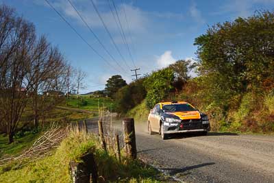 10;10;16-July-2011;APRC;Asia-Pacific-Rally-Championship;International-Rally-Of-Whangarei;Mitsubishi-Lancer-Evolution-X;NZ;New-Zealand;Northland;Rally;Sloan-Cox;Tarryn-Cox;Whangarei;auto;clouds;garage;landscape;motorsport;racing;scenery;sky;special-stage;wide-angle