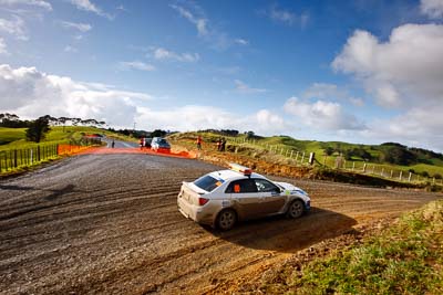 0;0;16-July-2011;APRC;Asia-Pacific-Rally-Championship;International-Rally-Of-Whangarei;NZ;New-Zealand;Northland;Rally;Safety-Car;Subaru-Impreza-WRX;Whangarei;auto;clouds;garage;motorsport;racing;sky;wide-angle
