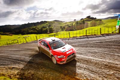 1;1;16-July-2011;APRC;Asia-Pacific-Rally-Championship;International-Rally-Of-Whangarei;Katsu-Taguchi;Mark-Stacey;Mitsubishi-Lancer-Evolution-X;NZ;New-Zealand;Northland;Rally;Team-MRF;Whangarei;auto;clouds;garage;landscape;motorsport;racing;scenery;sky;special-stage;wide-angle
