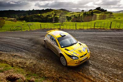 2;16-July-2011;2;APRC;Asia-Pacific-Rally-Championship;Chris-Atkinson;International-Rally-Of-Whangarei;NZ;New-Zealand;Northland;Proton-Motorsports;Proton-Satria-Neo-S2000;Rally;Stephane-Prevot;Whangarei;auto;garage;landscape;motorsport;racing;scenery;special-stage;wide-angle