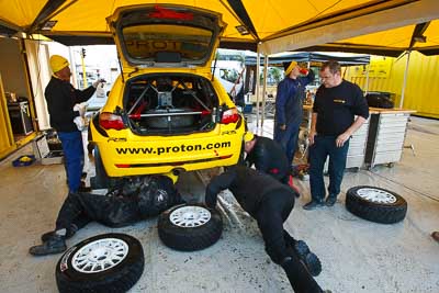 2;16-July-2011;2;APRC;Asia-Pacific-Rally-Championship;Chris-Atkinson;International-Rally-Of-Whangarei;NZ;New-Zealand;Northland;Proton-Motorsports;Proton-Satria-Neo-S2000;Rally;Stephane-Prevot;Whangarei;auto;garage;mechanics;motorsport;racing;service-park;wide-angle