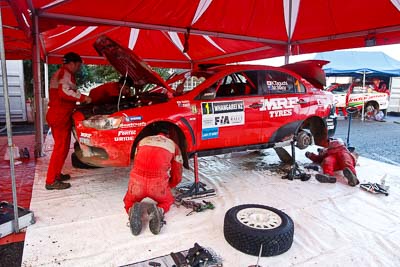 1;1;16-July-2011;APRC;Asia-Pacific-Rally-Championship;International-Rally-Of-Whangarei;Katsu-Taguchi;Mark-Stacey;Mitsubishi-Lancer-Evolution-X;NZ;New-Zealand;Northland;Rally;Team-MRF;Whangarei;auto;garage;mechanics;motorsport;racing;service-park;wide-angle