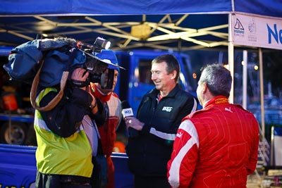 16-July-2011;50mm;APRC;Asia-Pacific-Rally-Championship;Daniel-Palau;International-Rally-Of-Whangarei;NZ;New-Zealand;Northland;Rally;Tony;Whangarei;auto;cameraman;garage;interview;media;motorsport;portrait;racing;service-park