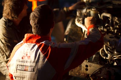 10;10;16-July-2011;2011-International-Rally-Of-Whangarei;50mm;APRC;Asia-Pacific-Rally-Championship;International-Rally-Of-Whangarei;Mitsubishi-Motors;NZ;New-Zealand;Northland;Ralliart;Sloan-Cox;Tarryn-Cox;Taslo-Engineering;Topshot;Whangarei;auto;close‒up;crew;detail;garage;mechanics;motorsport;portrait;racing;service-park;team