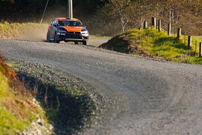 10;10;17-July-2011;APRC;Asia-Pacific-Rally-Championship;International-Rally-Of-Whangarei;Mitsubishi-Lancer-Evolution-X;NZ;New-Zealand;Northland;Rally;Sloan-Cox;Tarryn-Cox;Whangarei;auto;garage;motorsport;racing;special-stage;super-telephoto