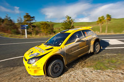 2;17-July-2011;2;APRC;Asia-Pacific-Rally-Championship;Chris-Atkinson;International-Rally-Of-Whangarei;NZ;New-Zealand;Northland;Proton;Proton-Motorsports;Proton-Satria-Neo-S2000;Rally;Stephane-Prevot;Whangarei;auto;clouds;garage;motorsport;racing;sky;special-stage;wide-angle