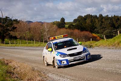 0;0;17-July-2011;APRC;Asia-Pacific-Rally-Championship;International-Rally-Of-Whangarei;NZ;New-Zealand;Northland;Rally;Safety-Car;Subaru-Impreza-WRX;Whangarei;auto;clouds;garage;motorsport;racing;sky;telephoto