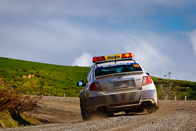 0;0;17-July-2011;APRC;Asia-Pacific-Rally-Championship;International-Rally-Of-Whangarei;NZ;New-Zealand;Northland;Rally;Safety-Car;Subaru-Impreza-WRX;Whangarei;auto;clouds;garage;motorsport;racing;sky;telephoto