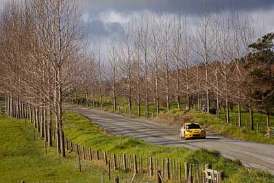 2;17-July-2011;2;APRC;Asia-Pacific-Rally-Championship;Chris-Atkinson;International-Rally-Of-Whangarei;NZ;New-Zealand;Northland;Proton;Proton-Motorsports;Proton-Satria-Neo-S2000;Rally;Stephane-Prevot;Whangarei;auto;garage;landscape;motorsport;racing;scenery;special-stage;telephoto