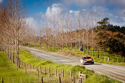 10;10;17-July-2011;APRC;Asia-Pacific-Rally-Championship;International-Rally-Of-Whangarei;Mitsubishi-Lancer-Evolution-X;NZ;New-Zealand;Northland;Rally;Sloan-Cox;Tarryn-Cox;Whangarei;auto;garage;landscape;motorsport;racing;scenery;special-stage;telephoto