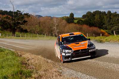 10;10;17-July-2011;APRC;Asia-Pacific-Rally-Championship;International-Rally-Of-Whangarei;Mitsubishi-Lancer-Evolution-X;NZ;New-Zealand;Northland;Rally;Sloan-Cox;Tarryn-Cox;Whangarei;auto;garage;landscape;motorsport;racing;scenery;special-stage;telephoto