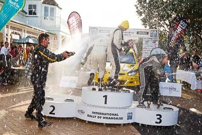 17-July-2011;APRC;Alister-McRae;Asia-Pacific-Rally-Championship;Bill-Hayes;Chris-Atkinson;Fleur-Pedersen;International-Rally-Of-Whangarei;NZ;New-Zealand;Northland;Rally;Stephane-Prevot;Whangarei;auto;champagne;garage;motorsport;podium;racing;wide-angle