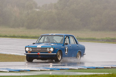 1;1;26-November-2011;Australia;Datsun-1600;Historic-Touring-Cars;Island-Magic;Melbourne;PIARC;Phillip-Island;Russell-Pilven;VIC;Victoria;auto;classic;motorsport;racing;rain;super-telephoto;vintage;wet