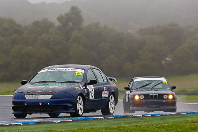 13;13;26-November-2011;Australia;Bronson-Butcher;Ford-Falcon-AU;Improved-Production;Island-Magic;Melbourne;PIARC;Phillip-Island;VIC;Victoria;auto;motorsport;racing;rain;super-telephoto;wet