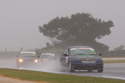 13;13;26-November-2011;Australia;Bronson-Butcher;Ford-Falcon-AU;Improved-Production;Island-Magic;Melbourne;PIARC;Phillip-Island;VIC;Victoria;auto;motorsport;racing;rain;super-telephoto;wet