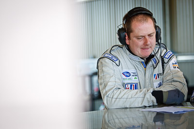 24-February-2012;Australia;Bathurst;Bathurst-12-Hour;Mt-Panorama;NSW;New-South-Wales;United-Autosports;atmosphere;auto;endurance;mechanic;motorsport;paddock;pitlane;portrait;racing;telephoto