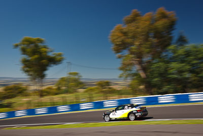 67;24-February-2012;67;Antony-Head;Australia;BMW-135i;Bathurst;Bathurst-12-Hour;John-De-Veth;Lewis-Scott;Motorsport-Services;Mt-Panorama;NSW;New-South-Wales;Todd-Murphy;auto;endurance;motion-blur;motorsport;racing;sky;wide-angle