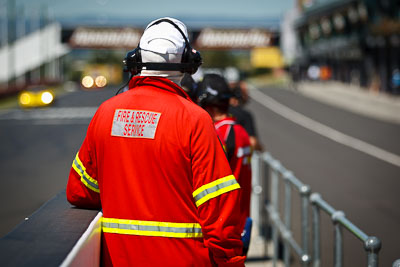 24-February-2012;Australia;Bathurst;Bathurst-12-Hour;Fireman;Mt-Panorama;NSW;New-South-Wales;Topshot;atmosphere;auto;endurance;motorsport;paddock;pitlane;portrait;racing;telephoto