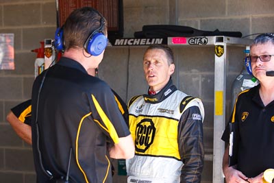 24-February-2012;Australia;Bathurst;Bathurst-12-Hour;Cameron-McConville;Mt-Panorama;NSW;New-South-Wales;atmosphere;auto;endurance;motorsport;paddock;pitlane;portrait;racing;telephoto