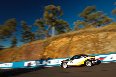 68;25-February-2012;68;Aaron-Harris;Australia;BMW-135i;Bathurst;Bathurst-12-Hour;David-Glasson;Dennis-Roderick;Motorsport-Services;Mt-Panorama;NSW;New-South-Wales;auto;endurance;motion-blur;motorsport;racing;wide-angle