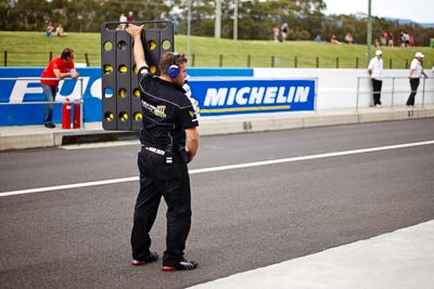 25-February-2012;50mm;Australia;Bathurst;Bathurst-12-Hour;Maranello-Motorsport;Mt-Panorama;NSW;New-South-Wales;atmosphere;auto;endurance;mechanic;motorsport;paddock;pitlane;portrait;racing