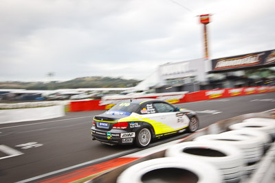 67;26-February-2012;67;Antony-Head;Australia;BMW-135i;Bathurst;Bathurst-12-Hour;John-De-Veth;Lewis-Scott;Motorsport-Services;Mt-Panorama;NSW;New-South-Wales;Todd-Murphy;auto;endurance;motion-blur;motorsport;racing;wide-angle