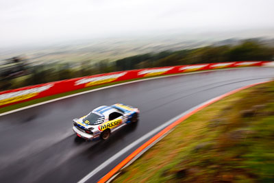 32;26-February-2012;Australia;Bathurst;Bathurst-12-Hour;Gerry-Murphy;Jim-Pollicina;Mazda-RX‒7;Mazda-RX7;Michael-Caine;Mt-Panorama;NSW;New-South-Wales;auto;endurance;motion-blur;motorsport;racing;rain;wet;wide-angle