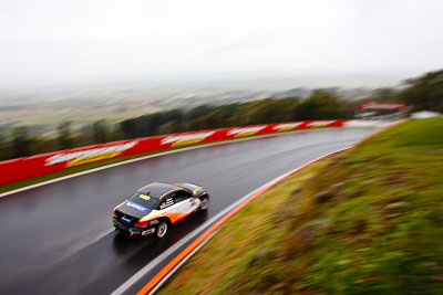 68;26-February-2012;68;Aaron-Harris;Australia;BMW-135i;Bathurst;Bathurst-12-Hour;David-Glasson;Dennis-Roderick;Motorsport-Services;Mt-Panorama;NSW;New-South-Wales;auto;endurance;motion-blur;motorsport;racing;rain;wet;wide-angle