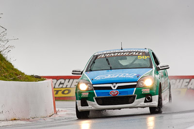 50;26-February-2012;Australia;Bathurst;Bathurst-12-Hour;Chris-Pither;Elliot-Barbour;Holden-HSV-VXR;Mt-Panorama;NSW;New-South-Wales;Racer-Industries;Scott-Pye;auto;endurance;motorsport;racing;rain;super-telephoto;wet