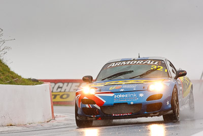 32;26-February-2012;Australia;Bathurst;Bathurst-12-Hour;Gerry-Murphy;Jim-Pollicina;Mazda-RX‒7;Mazda-RX7;Michael-Caine;Mt-Panorama;NSW;New-South-Wales;auto;endurance;motorsport;racing;rain;super-telephoto;wet