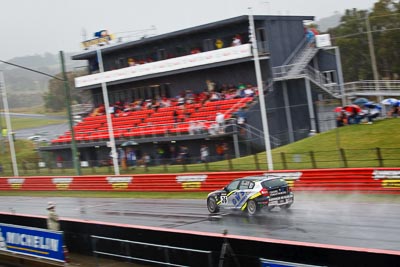 26;26;26-February-2012;Angus-Chapel;Australia;BMW-130i;Bathurst;Bathurst-12-Hour;GWS-Personnel-Motorsport;Mt-Panorama;NSW;New-South-Wales;Richard-Gartner;Tony-Prior;auto;endurance;motion-blur;motorsport;racing;rain;telephoto;wet