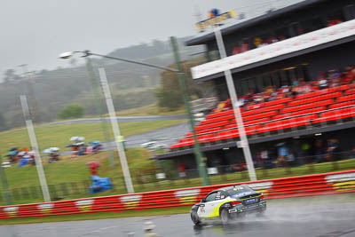 67;26-February-2012;67;Antony-Head;Australia;BMW-135i;Bathurst;Bathurst-12-Hour;John-De-Veth;Lewis-Scott;Motorsport-Services;Mt-Panorama;NSW;New-South-Wales;Todd-Murphy;auto;endurance;motion-blur;motorsport;racing;rain;telephoto;wet