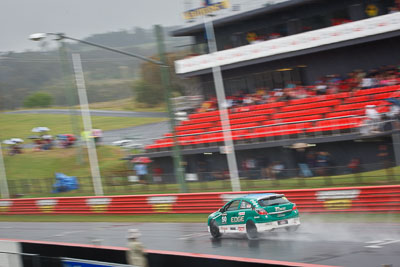 50;26-February-2012;Australia;Bathurst;Bathurst-12-Hour;Chris-Pither;Elliot-Barbour;Holden-HSV-VXR;Mt-Panorama;NSW;New-South-Wales;Racer-Industries;Scott-Pye;auto;endurance;motion-blur;motorsport;racing;rain;telephoto;wet