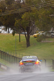 67;26-February-2012;67;Antony-Head;Australia;BMW-135i;Bathurst;Bathurst-12-Hour;John-De-Veth;Lewis-Scott;Motorsport-Services;Mt-Panorama;NSW;New-South-Wales;Todd-Murphy;auto;endurance;motorsport;racing;rain;telephoto;wet