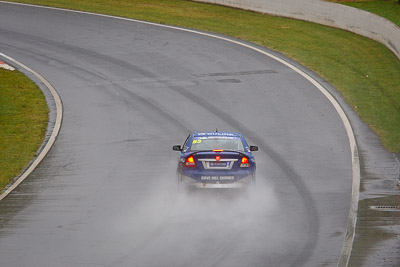 53;26-February-2012;Australia;Bathurst;Bathurst-12-Hour;Dean-Lillie;Holden-HSV-GTS;James-Atkinson;Mt-Panorama;NSW;New-South-Wales;Rick-Newman;auto;endurance;motorsport;racing;rain;telephoto;wet