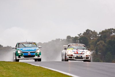 50;65;26-February-2012;65;Australia;Bathurst;Bathurst-12-Hour;Brett-Niall;Chris-Pither;Elliot-Barbour;Holden-HSV-VXR;Motorsport-Services;Mt-Panorama;NSW;New-South-Wales;Porsche-911-GT3-Cup-997;Racer-Industries;Scott-ODonnell;Scott-Pye;Simon-McLennon;auto;endurance;motorsport;racing;rain;super-telephoto;wet