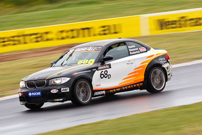 68;26-February-2012;68;Aaron-Harris;Australia;BMW-135i;Bathurst;Bathurst-12-Hour;David-Glasson;Dennis-Roderick;Motorsport-Services;Mt-Panorama;NSW;New-South-Wales;auto;endurance;motion-blur;motorsport;racing;rain;super-telephoto;wet