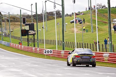 67;26-February-2012;67;Antony-Head;Australia;BMW-135i;Bathurst;Bathurst-12-Hour;John-De-Veth;Lewis-Scott;Motorsport-Services;Mt-Panorama;NSW;New-South-Wales;Todd-Murphy;auto;endurance;motorsport;racing;rain;telephoto;wet