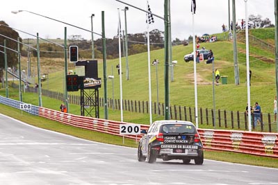 26;26;26-February-2012;Angus-Chapel;Australia;BMW-130i;Bathurst;Bathurst-12-Hour;GWS-Personnel-Motorsport;Mt-Panorama;NSW;New-South-Wales;Richard-Gartner;Tony-Prior;auto;endurance;motorsport;racing;rain;telephoto;wet