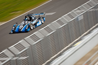 17;17;22-September-2012;Australia;Peter-Johnston;Phillip-Island;Radical;Shannons-Nationals;VIC;Victoria;atmosphere;auto;fence;motion-blur;motorsport;pitlane;racing;telephoto