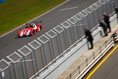 41;22-September-2012;Australia;Neale-Muston;Phillip-Island;Radical;Shannons-Nationals;VIC;Victoria;auto;fence;motion-blur;motorsport;racing;telephoto