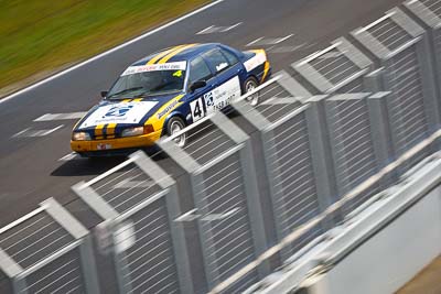 4;23-September-2012;4;Australia;Ford-Falcon-EA;Phillip-Island;Saloon-Cars;Shannons-Nationals;Tony-Auddino;VIC;Victoria;auto;fence;motion-blur;motorsport;racing;telephoto