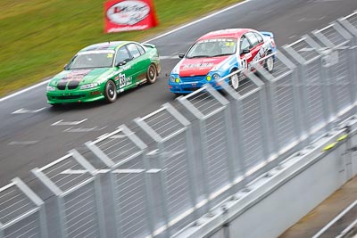 38;42;23-September-2012;38;Australia;Ford-Falcon-AU;Gavin-Ross;Holden-Commodore-VT;John-McCorkindale;Phillip-Island;Saloon-Cars;Shannons-Nationals;VIC;Victoria;auto;fence;motion-blur;motorsport;racing;telephoto