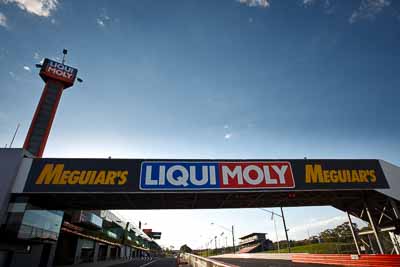 7-February-2013;Australia;Bathurst;Bathurst-12-Hour;Mt-Panorama;NSW;New-South-Wales;afternoon;atmosphere;auto;building;endurance;morning;motorsport;pitlane;racing;sky;tower;wide-angle