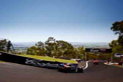 77;77;8-February-2013;Aston-Martin;Australia;Bathurst;Bathurst-12-Hour;Grand-Tourer;Mt-Panorama;NSW;New-South-Wales;The-Dipper;Tony-Quinn;auto;endurance;motion-blur;motorsport;racing;sky;wide-angle