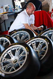 8-February-2013;Australia;Bathurst;Bathurst-12-Hour;Grand-Tourer;Mt-Panorama;NSW;New-South-Wales;atmosphere;auto;endurance;mechanic;motorsport;paddock;portrait;racing;telephoto;tyres;wheels